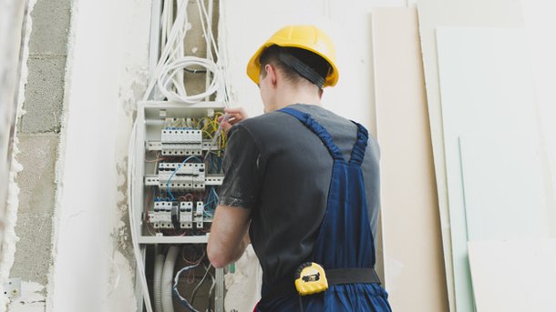 young-man-working-with-wires-at-switcher 23-2147743118